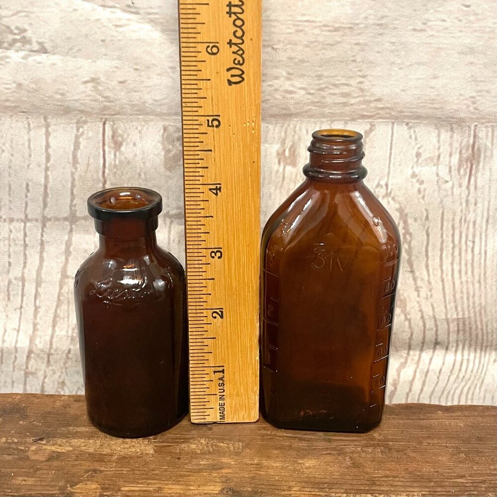 Vintage amber glass lysol and medicine bottles